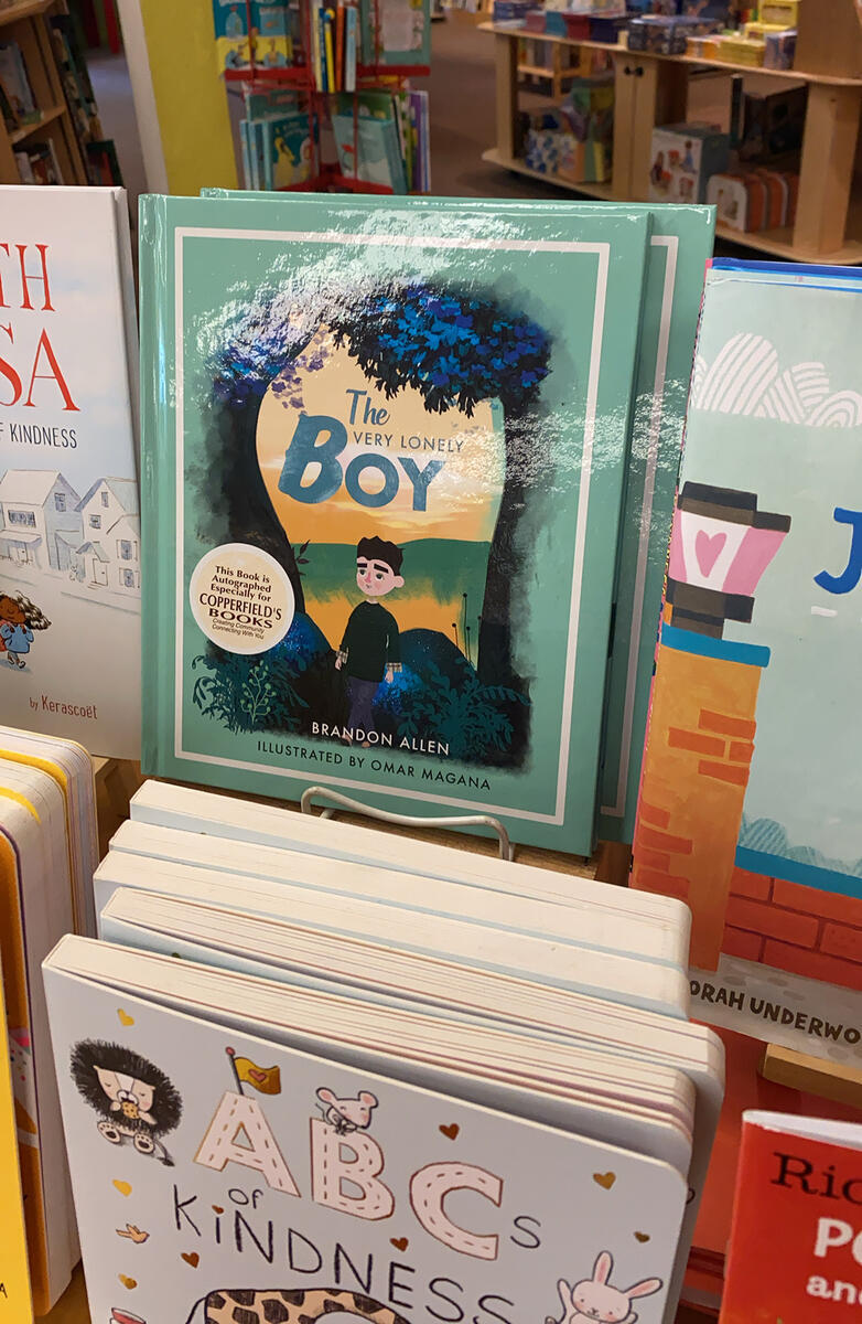 Copies of "The Very Lonely Boy" on display in a bookstore