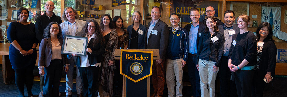 Members of the CalHOPE Student Support Team received the Chancellor's Award, they are standing behind a Berkeley podium