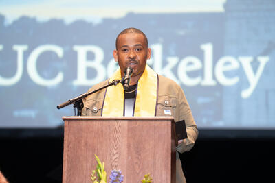 Dorel Baca delivering the Commencement keynote address