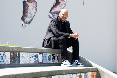 Brian McGhee sitting on steps at McClymonds HIgh School