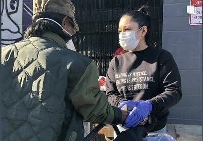 Sabrina Valadez-Rios and a community member